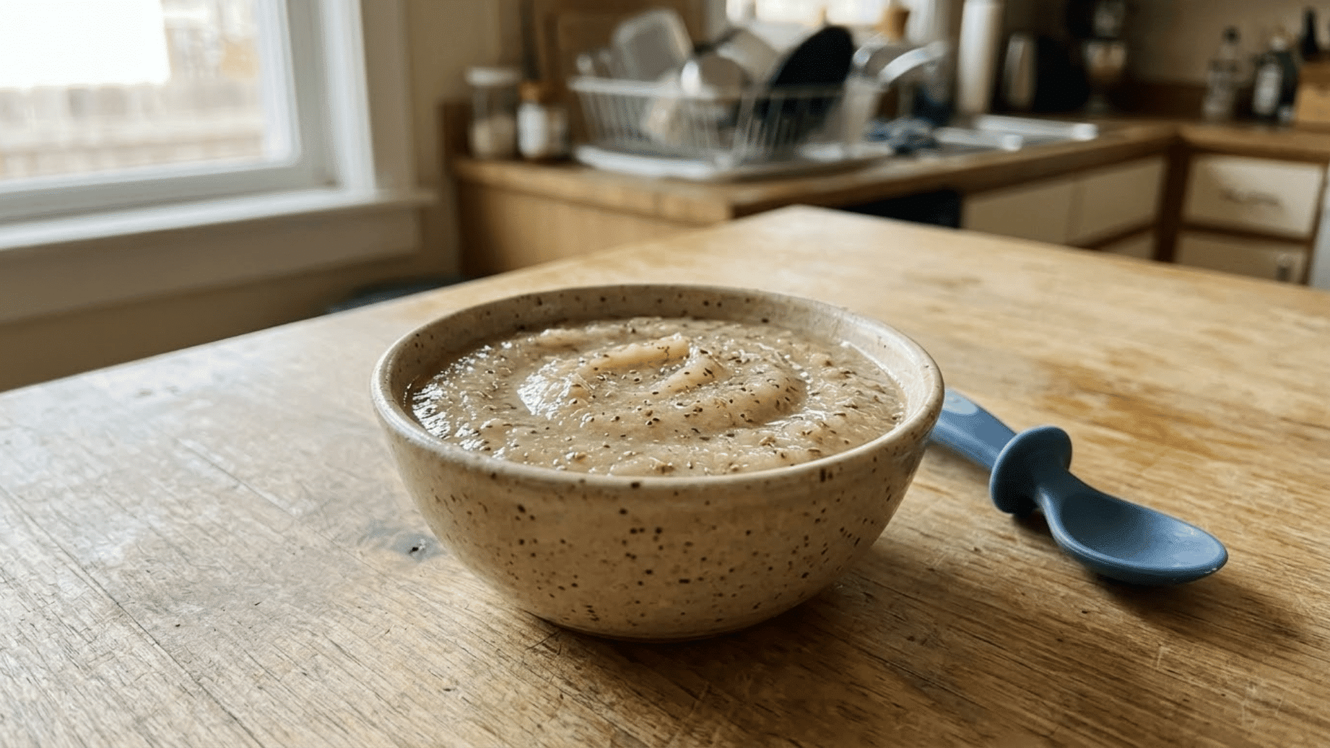unsweetened applesauce mixed with ground flaxseed in a toddler bowl