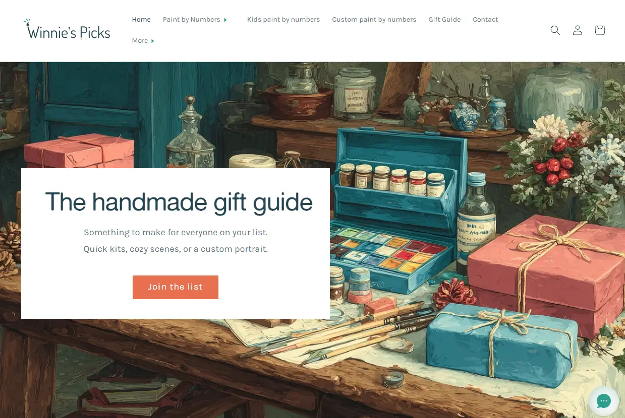 Art supplies and wrapped gifts on wooden table in rustic studio setting